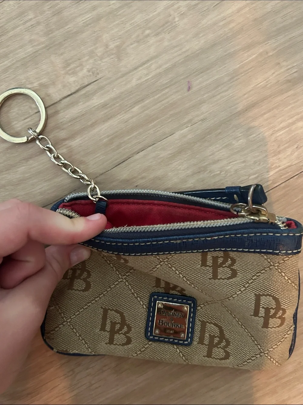 Dooney & Bourke Beige Canvas Wristlet with Navy Trim and Logo